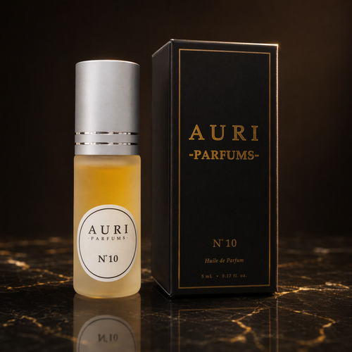 AURI No.10 alcohol-free roll-on perfume oil with black gift box on dark marble, inspired by Chanel Coco Mademoiselle
