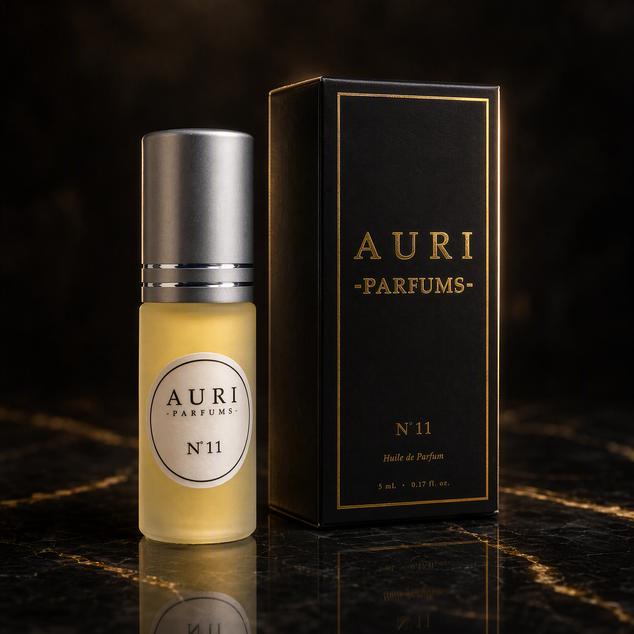 AURI No.11 alcohol-free roll-on perfume oil with black gift box on dark marble, inspired by Jean Paul Gaultier Scandal