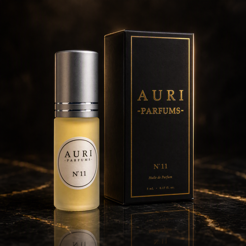 AURI No.11 alcohol-free roll-on perfume oil with black gift box on dark marble, inspired by Jean Paul Gaultier Scandal