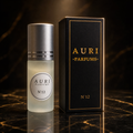 AURI No.12 alcohol-free roll-on perfume oil with black gift box on dark marble, inspired by Bvlgari Tygar