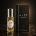 AURI No.13 alcohol-free roll-on perfume oil with black gift box on dark marble, inspired by Jannatul Firdaus