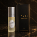 AURI No.6 alcohol-free roll-on perfume oil with black gift box on dark marble, inspired by Dior J'adore