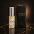 AURI No.9 alcohol-free roll-on perfume oil with black gift box on dark marble, inspired by Maison Francis Kurkdjian Baccarat Rouge 540